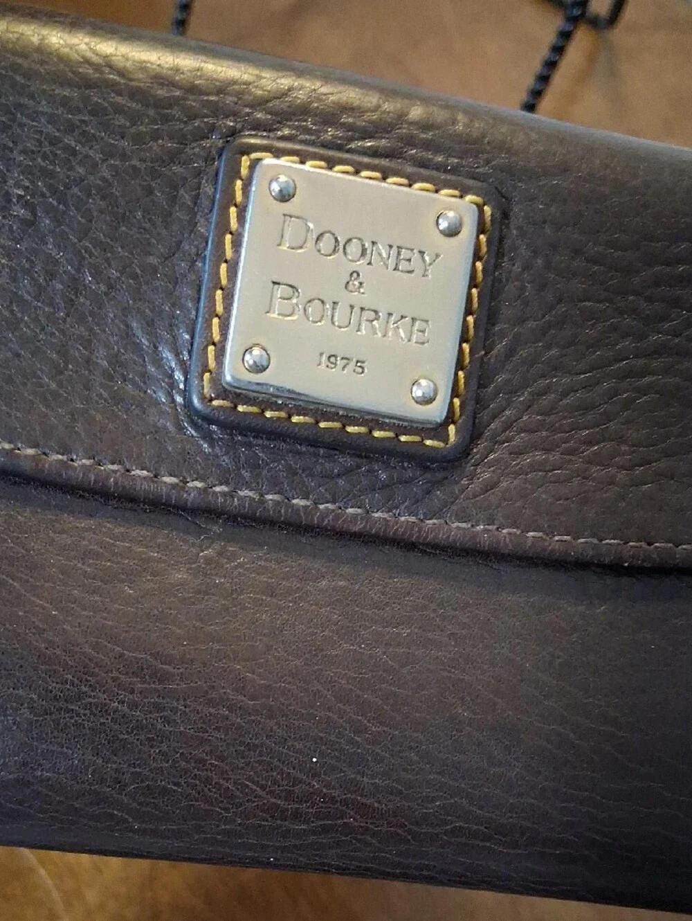 Dooney & Bourke Dark Brown Leather Wallet with Metal Logo Plaque